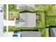 This aerial showcases a home with a large fenced yard and a deck, offering a private outdoor space at 2427 Apple Tree Ln, Indianapolis, IN 46229