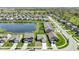 An aerial view capturing a residential neighborhood and a pond, with homes featuring well-maintained lawns at 2427 Apple Tree Ln, Indianapolis, IN 46229