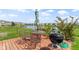 The deck area features a lake view, outdoor dining setup, and grill for entertaining or enjoying a meal at 2427 Apple Tree Ln, Indianapolis, IN 46229