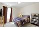 Comfortable bedroom with carpeted flooring, a large window, and closet at 2427 Apple Tree Ln, Indianapolis, IN 46229