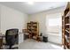 Office space with carpeted flooring, desk, and storage at 2427 Apple Tree Ln, Indianapolis, IN 46229