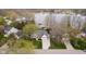 Aerial view of a home near a lake with mature trees and meticulous landscaping at 2428 Hawthorn Pl, Noblesville, IN 46062