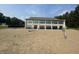 Community beach house with expansive windows, offering picturesque views of the sandy beach and waterfront at 2428 Hawthorn Pl, Noblesville, IN 46062