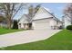 Charming exterior elevation of home featuring a well-manicured lawn, and a wide driveway at 2428 Hawthorn Pl, Noblesville, IN 46062