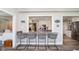 Open kitchen featuring a breakfast bar with seating and a view into the main cooking area with stainless steel appliances at 2428 Hawthorn Pl, Noblesville, IN 46062