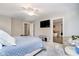 Bright main bedroom featuring an attached bathroom with tub and overhead lighting at 2428 Hawthorn Pl, Noblesville, IN 46062