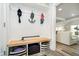 Organized mudroom area with built-in bench, storage cubbies, and hooks for hanging items at 2428 Hawthorn Pl, Noblesville, IN 46062