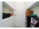 Storage room area with white built-in shelving units, carpeted floor, and ample storage space at 2428 Hawthorn Pl, Noblesville, IN 46062