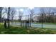 Community tennis court with well-maintained surface and surrounding fence, perfect for sports and recreation at 2428 Hawthorn Pl, Noblesville, IN 46062
