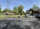 Backyard features a chain-link fence, a shed, and a patio area for entertaining at 244 E Cragmont Dr, Indianapolis, IN 46227