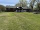 Lawn and backyard area that features a covered patio at 244 E Cragmont Dr, Indianapolis, IN 46227