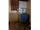 This basement has a blue water tank and some pipes at 244 E Cragmont Dr, Indianapolis, IN 46227