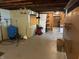 Unfinished basement with exposed ceiling beams and ample space for storage or customization at 244 E Cragmont Dr, Indianapolis, IN 46227