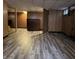 This basement has wood paneling and wood-look flooring at 244 E Cragmont Dr, Indianapolis, IN 46227