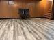 Basement with wood-look flooring and a view of the staircase at 244 E Cragmont Dr, Indianapolis, IN 46227