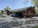 Exterior view showcases the attached garage and patio area at 244 E Cragmont Dr, Indianapolis, IN 46227