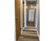 This hallway has neutral paint and wood-look flooring at 244 E Cragmont Dr, Indianapolis, IN 46227
