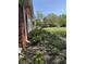 Charming side of house with well-maintained landscaping and brick exterior at 244 E Cragmont Dr, Indianapolis, IN 46227