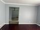 Cozy living area with hardwood floors and a clear view into the next room at 244 E Cragmont Dr, Indianapolis, IN 46227
