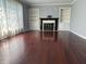Spacious living room featuring hardwood floors, a fireplace, and built-in bookshelves at 244 E Cragmont Dr, Indianapolis, IN 46227