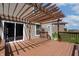 Back deck featuring a brown wood pergola and brown wood railings at 2545 Coneflower Ct, Columbus, IN 47201