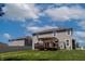 This spacious backyard features a wood deck with a pergola perfect for entertaining or relaxing under the open sky at 2545 Coneflower Ct, Columbus, IN 47201