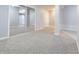 Finished basement area with closet featuring mirrored doors and plush carpeting at 2545 Coneflower Ct, Columbus, IN 47201