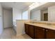 Bathroom with double sink vanity, soaking tub, neutral tile flooring and a large mirror at 2545 Coneflower Ct, Columbus, IN 47201