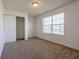 Bedroom with neutral carpet and large window bringing in natural light at 2545 Coneflower Ct, Columbus, IN 47201
