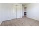 Bedroom with double sliding door closet and neutral carpet, featuring natural light at 2545 Coneflower Ct, Columbus, IN 47201