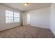 Bedroom with neutral carpet and a large window for natural light at 2545 Coneflower Ct, Columbus, IN 47201
