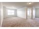 Spacious bonus room featuring neutral carpet and windows for natural light at 2545 Coneflower Ct, Columbus, IN 47201
