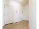 The entryway offers neutral tile flooring and wall mounted coat hooks near front and closet doors at 2545 Coneflower Ct, Columbus, IN 47201