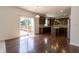 Stylish eat-in kitchen with hardwood floors, dark wood cabinets, kitchen island, and sliding glass doors to a deck at 2545 Coneflower Ct, Columbus, IN 47201