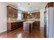 Modern kitchen featuring dark wood cabinets, granite countertops, stainless steel appliances, and a kitchen island at 2545 Coneflower Ct, Columbus, IN 47201
