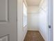 Walk-in closet with wire shelving and neutral carpet at 2545 Coneflower Ct, Columbus, IN 47201