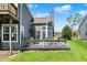 View of the home's backyard and deck area with a patio, ideal for outdoor entertaining at 2809 Somerset Bay, Indianapolis, IN 46240