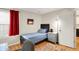 Cozy bedroom with a single bed, nightstand, and a window with natural light at 2809 Somerset Bay, Indianapolis, IN 46240