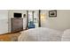 Bright bedroom with a chest of drawers, cozy blue rocking chair, and a sunlit corner window at 2809 Somerset Bay, Indianapolis, IN 46240
