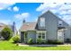 Charming two-story condo featuring a well-maintained lawn and beautiful landscaping at 2809 Somerset Bay, Indianapolis, IN 46240