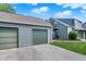 Two-car garage located near the home, providing ample parking with green garage doors at 2809 Somerset Bay, Indianapolis, IN 46240