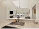 Bright kitchen features marble counters, stainless steel sink, and views into the living room at 2809 Somerset Bay, Indianapolis, IN 46240