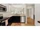 Bright open kitchen featuring modern appliances, beautiful hardwood floors, and ample cabinet space at 2809 Somerset Bay, Indianapolis, IN 46240