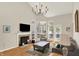 Bright living room features fireplace, vaulted ceilings, and an abundance of natural light at 2809 Somerset Bay, Indianapolis, IN 46240