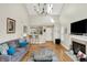 Bright living room with vaulted ceiling, fireplace, and breakfast bar offering spacious living at 2809 Somerset Bay, Indianapolis, IN 46240