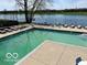 Community pool overlooks calm waters, providing a relaxing spot to enjoy sunny days at 2809 Somerset Bay, Indianapolis, IN 46240