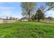 Expansive backyard boasting lush green grass and mature trees offering plenty of room for outdoor enjoyment at 2822 Walker Ave, Indianapolis, IN 46203