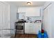 Cozy kitchen featuring stainless steel appliances, white cabinets, and a sink with ample counter space for food preparation at 2822 Walker Ave, Indianapolis, IN 46203