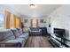 Comfortable living room features hardwood floors, large windows and neutral tones, and ample seating at 2822 Walker Ave, Indianapolis, IN 46203