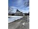 Charming home featuring a covered porch with white railings on a partially snow covered lot at 3333 S Sr 9, Greenfield, IN 46140
